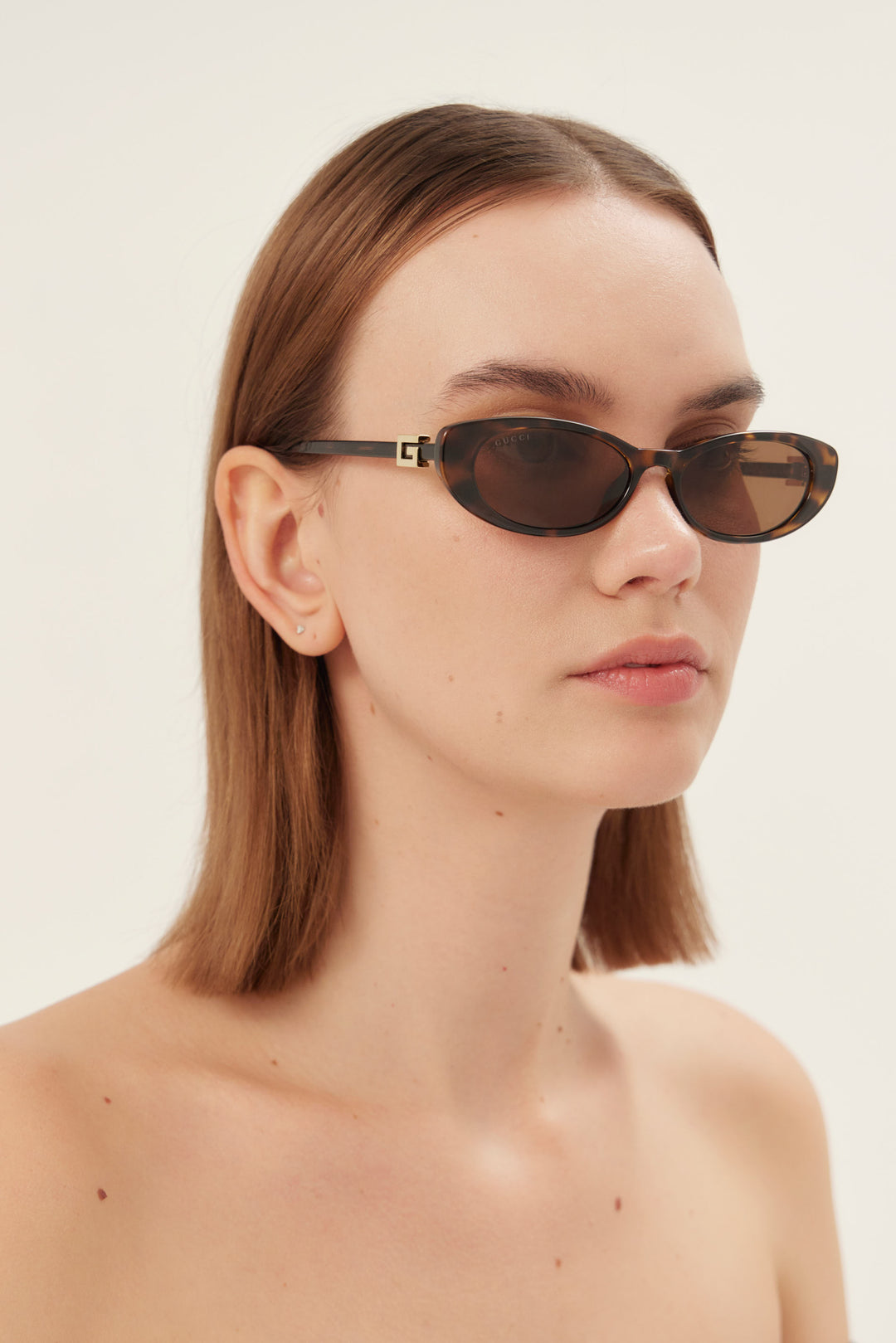 PRE PEDIDO - Gafas de sol Gucci ovaladas de ojo de gato en marrón habano con logotipo dorado