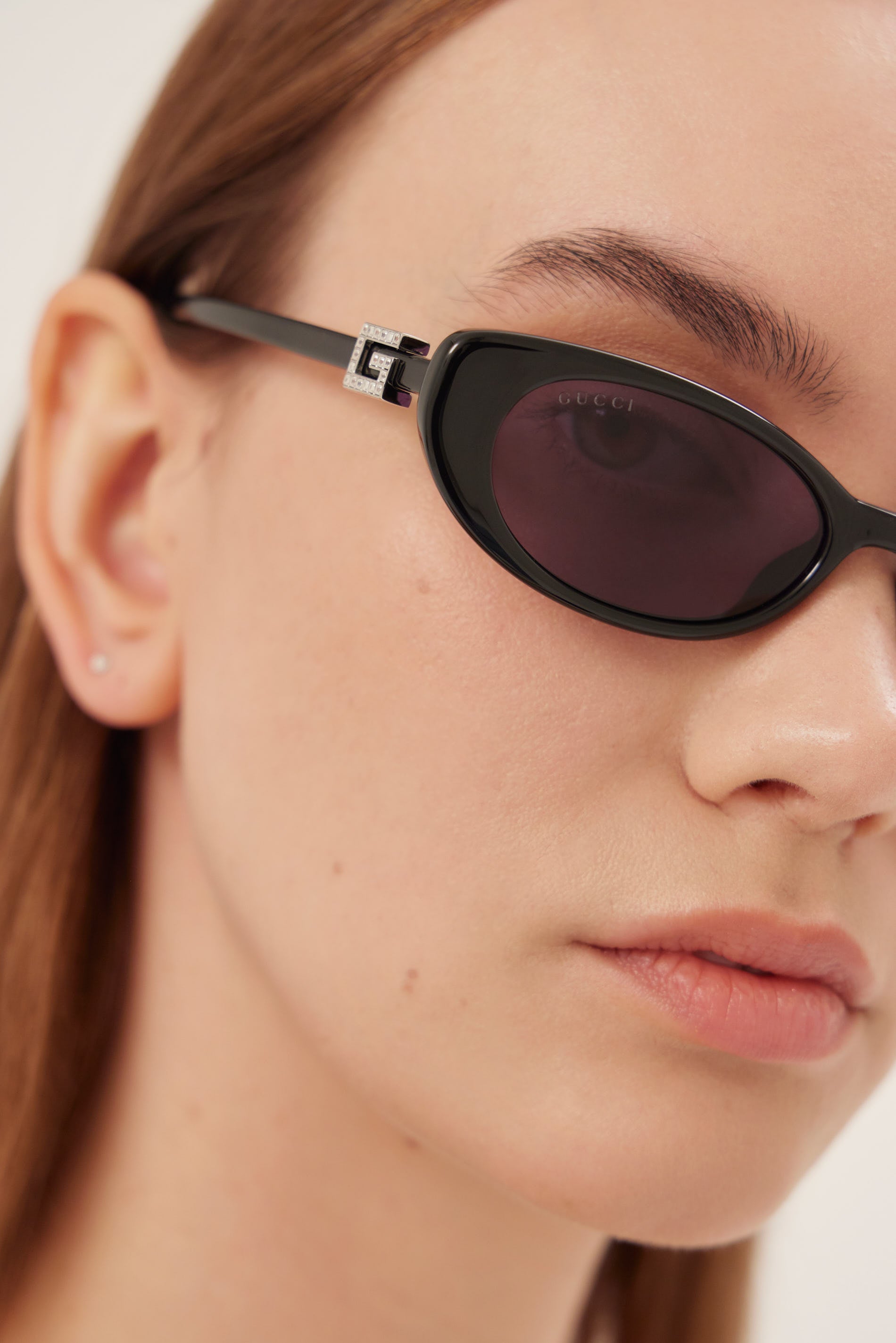 PRE ORDER Oval cat-eye black Gucci sunglasses with bedded logo